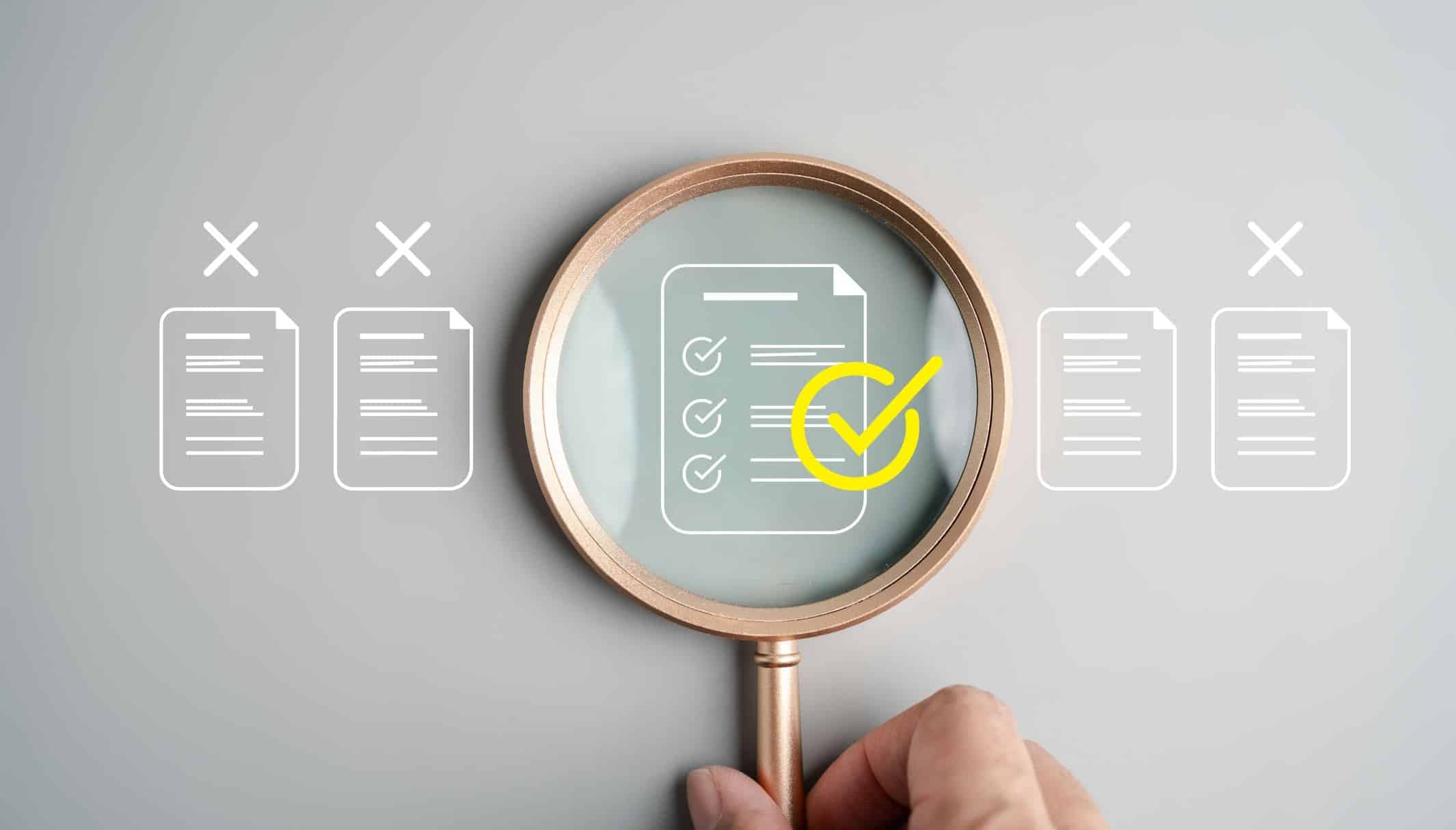 A magnifying glass over rows of document icons, singling out the one marked with ticks.