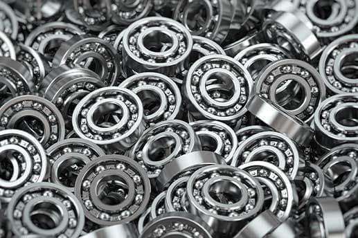 A heap of steel ball bearings, seen close up.