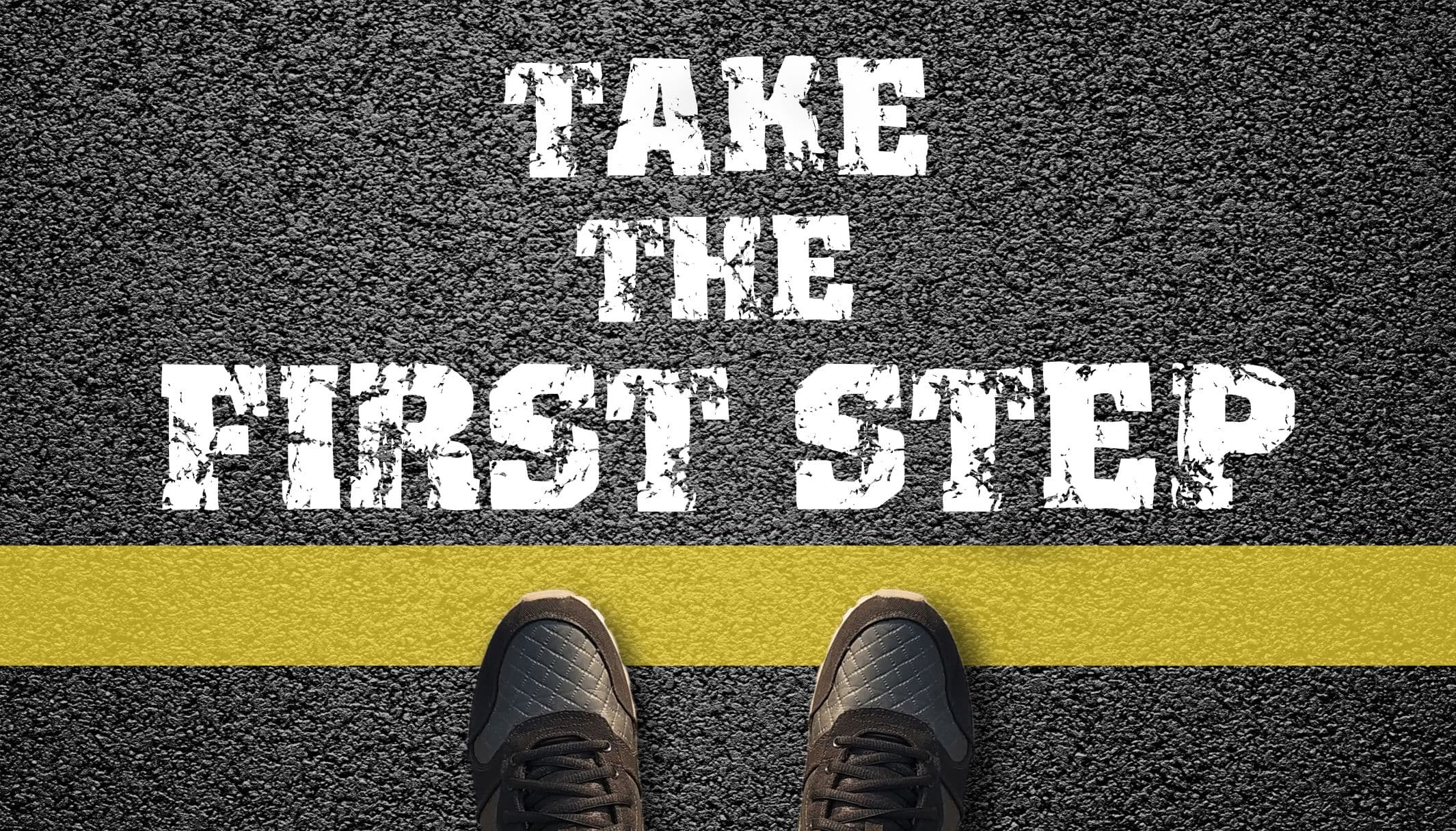 Take the first step painted on asphalt, with a pair of shoes at the yellow line.