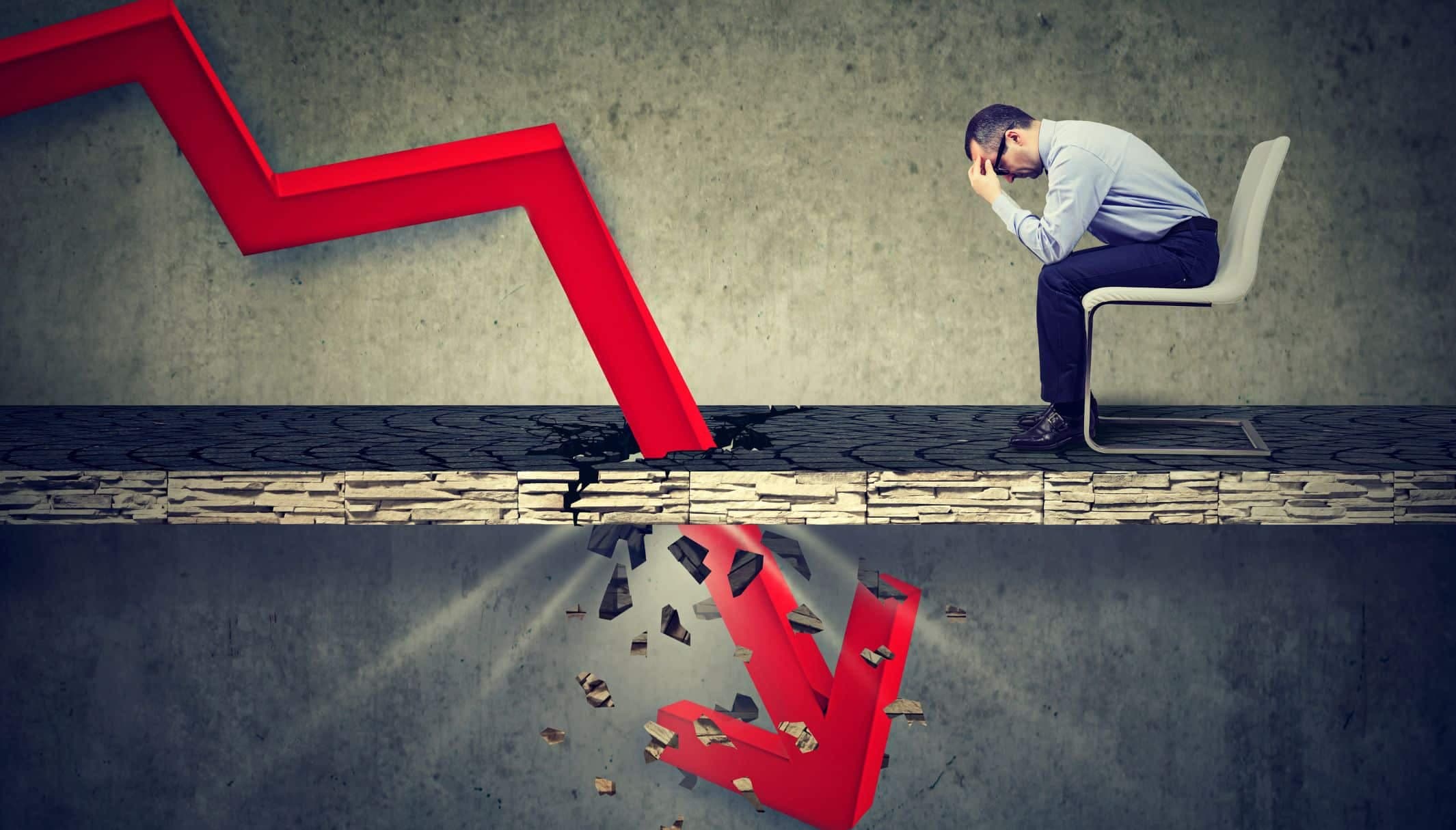 Illustration of a red trend arrow smashing through the floor beside a man slumped on a chair.