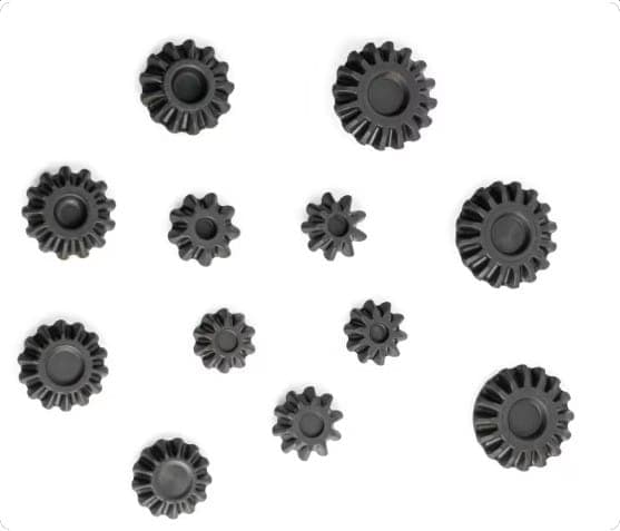 Eleven black bevel gears of several sizes arranged on a white background.